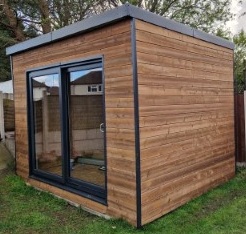 Finished SIP garden room with timber cladding, trims and glazing installed