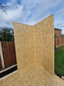 Customer build showing first SIP wall panels being stood in position